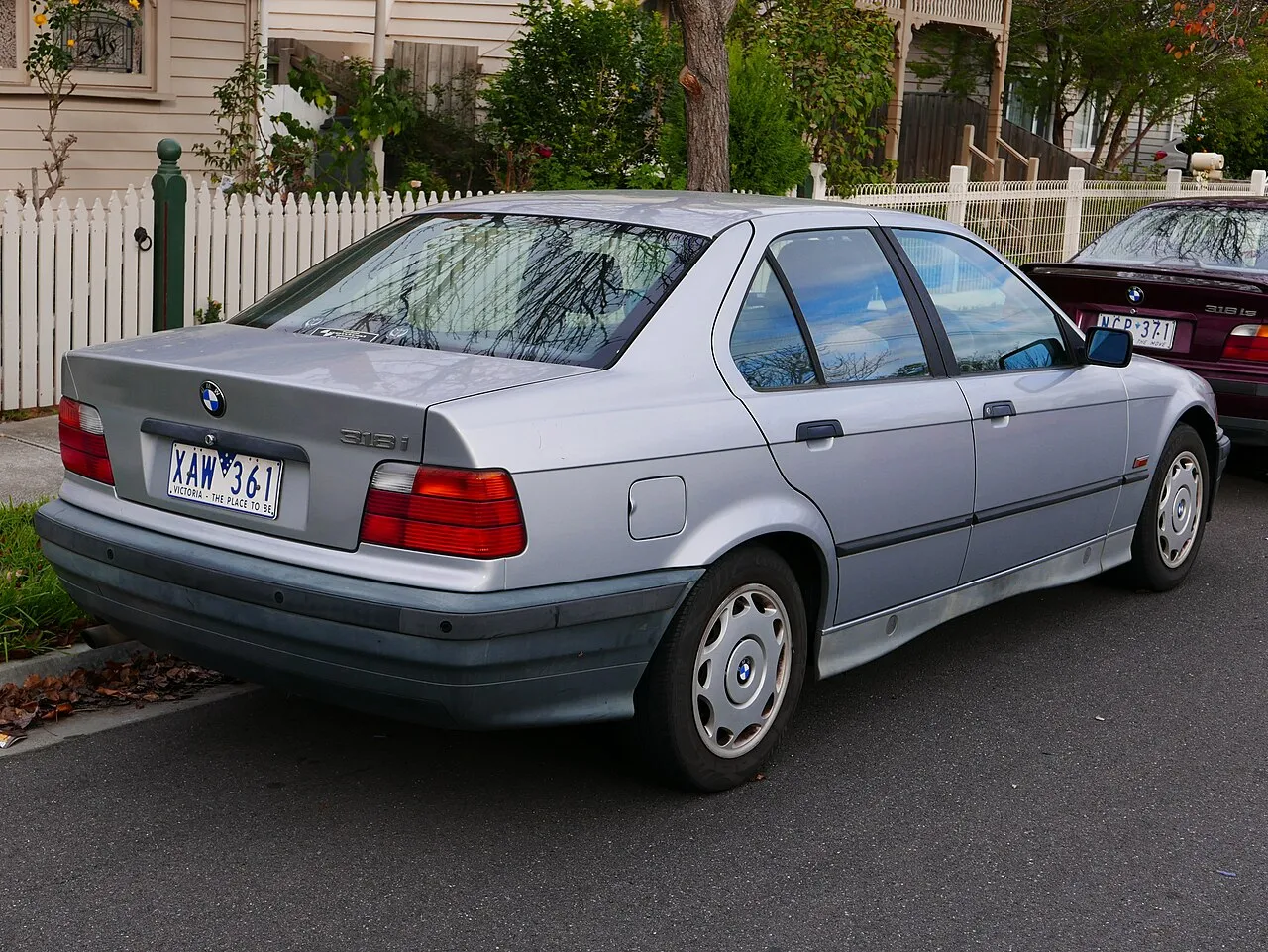 1994 BMW E36 318i sedan, rear three-quarter view
