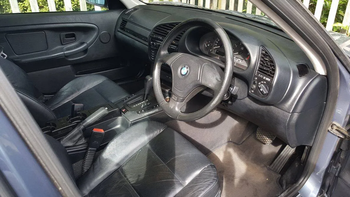 BMW E36 front interior showing the door panel